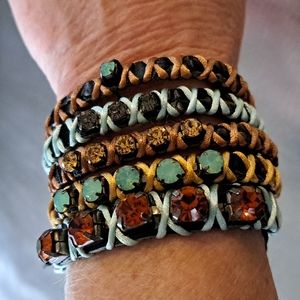 Nwt leather cuff bracelet with rhinestones/fabric stitching. Adjustable snaps.